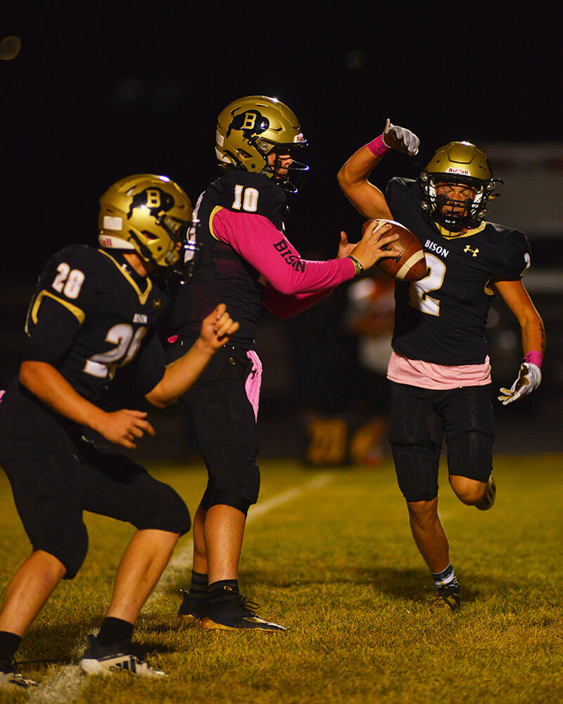 Michael Ihnat fakes a handoff before quarterback Jackson Moon hands the ball off to Ben Camino